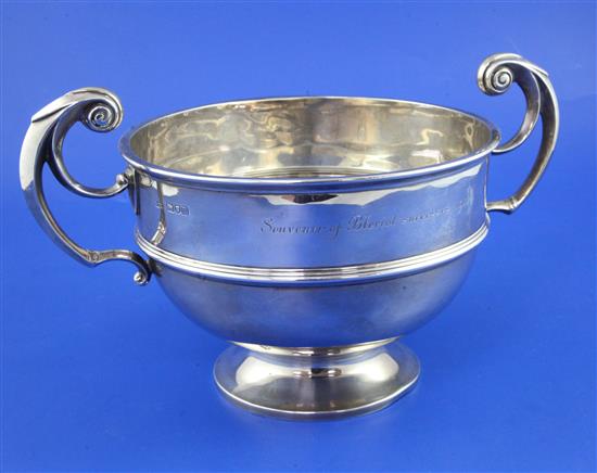 An Edwardian silver presentation two handled pedestal rose bowl